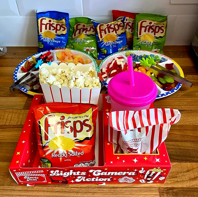 Red Lights Camera Action tray with crisps, popcorn and a pink cup