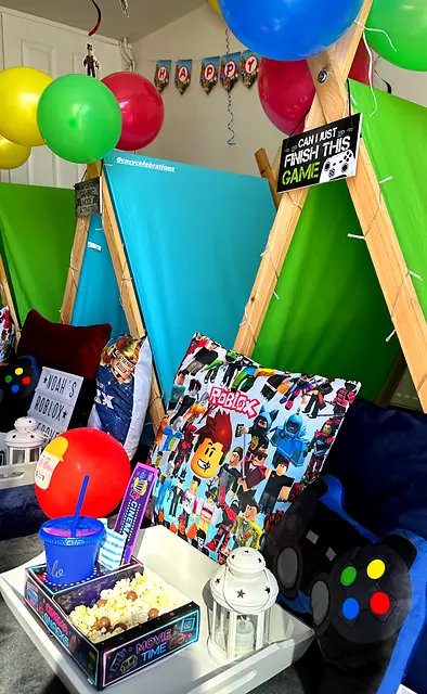 Play tents, balloons and a neon snack tray at a gaming sleepover